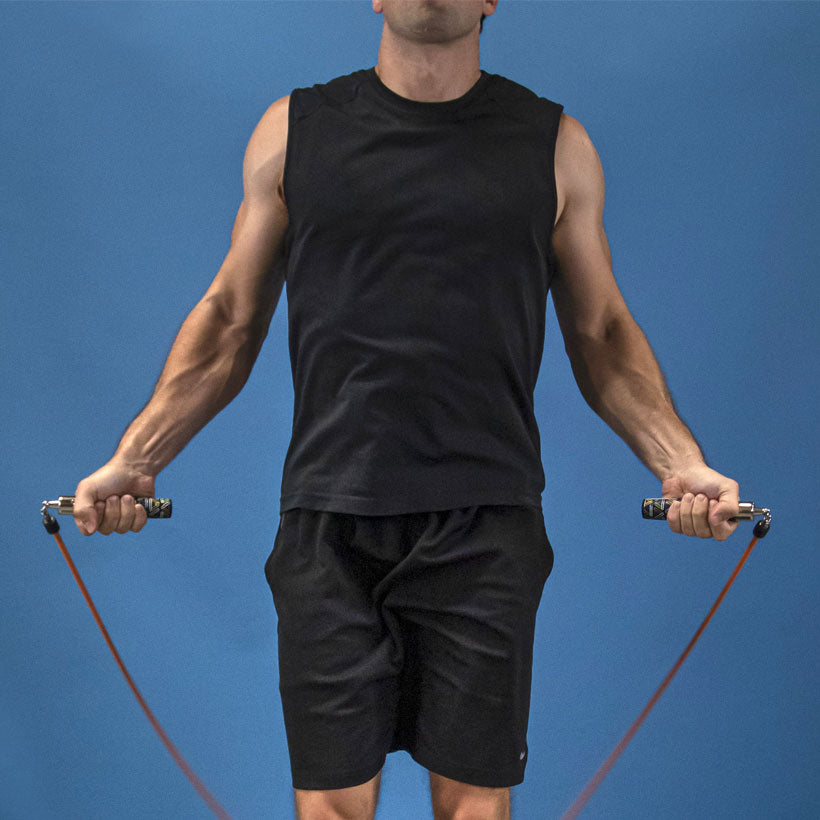Heavy Speed Performance Set Man jumping with a 1 LB Speed Pro rope with Speed Pro LE handles